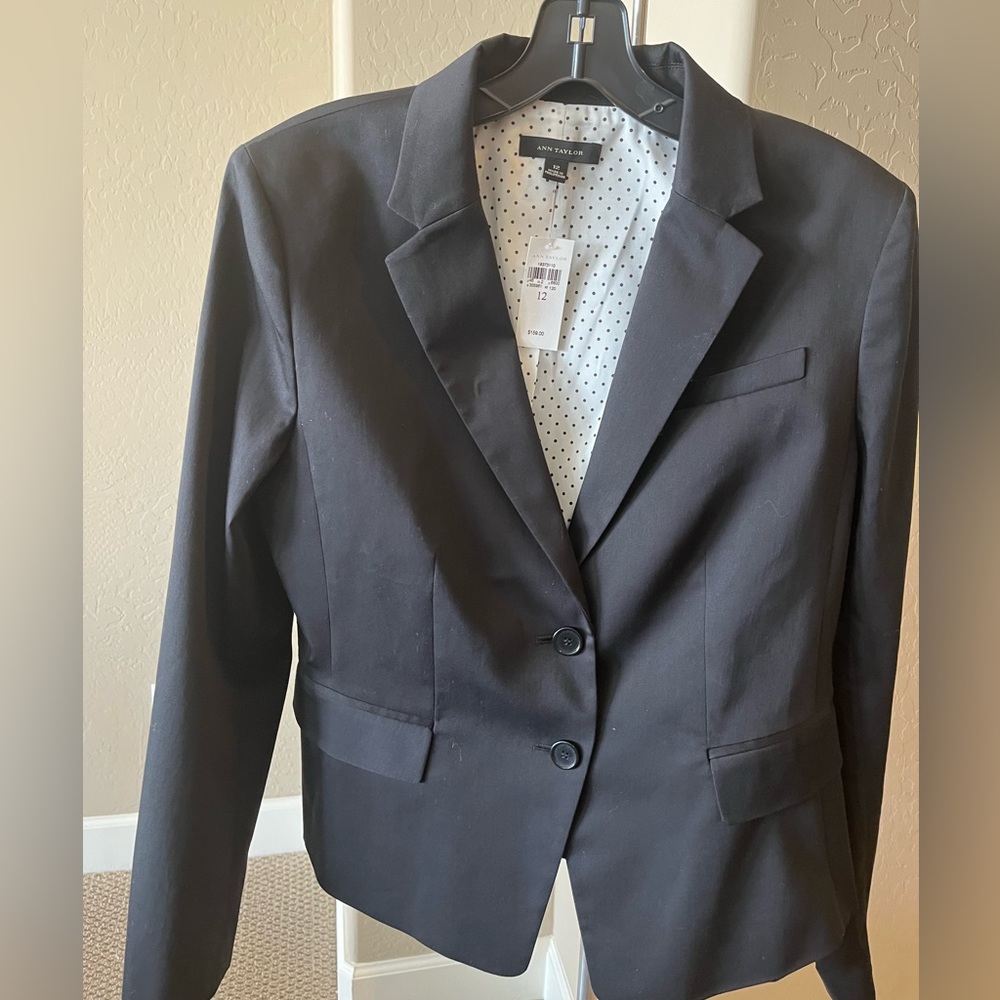 Ann Taylor Suit black includes jacket, pants and skirt.  Size 12.